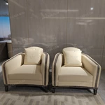 Cream Leather Sofa Set with Wave Quilted Craftsmanship, Natural Wood Veneer & Embroidered Wing Logo Accents